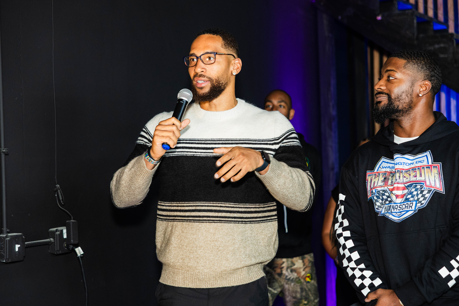Jorden Paige speaking with a microphone